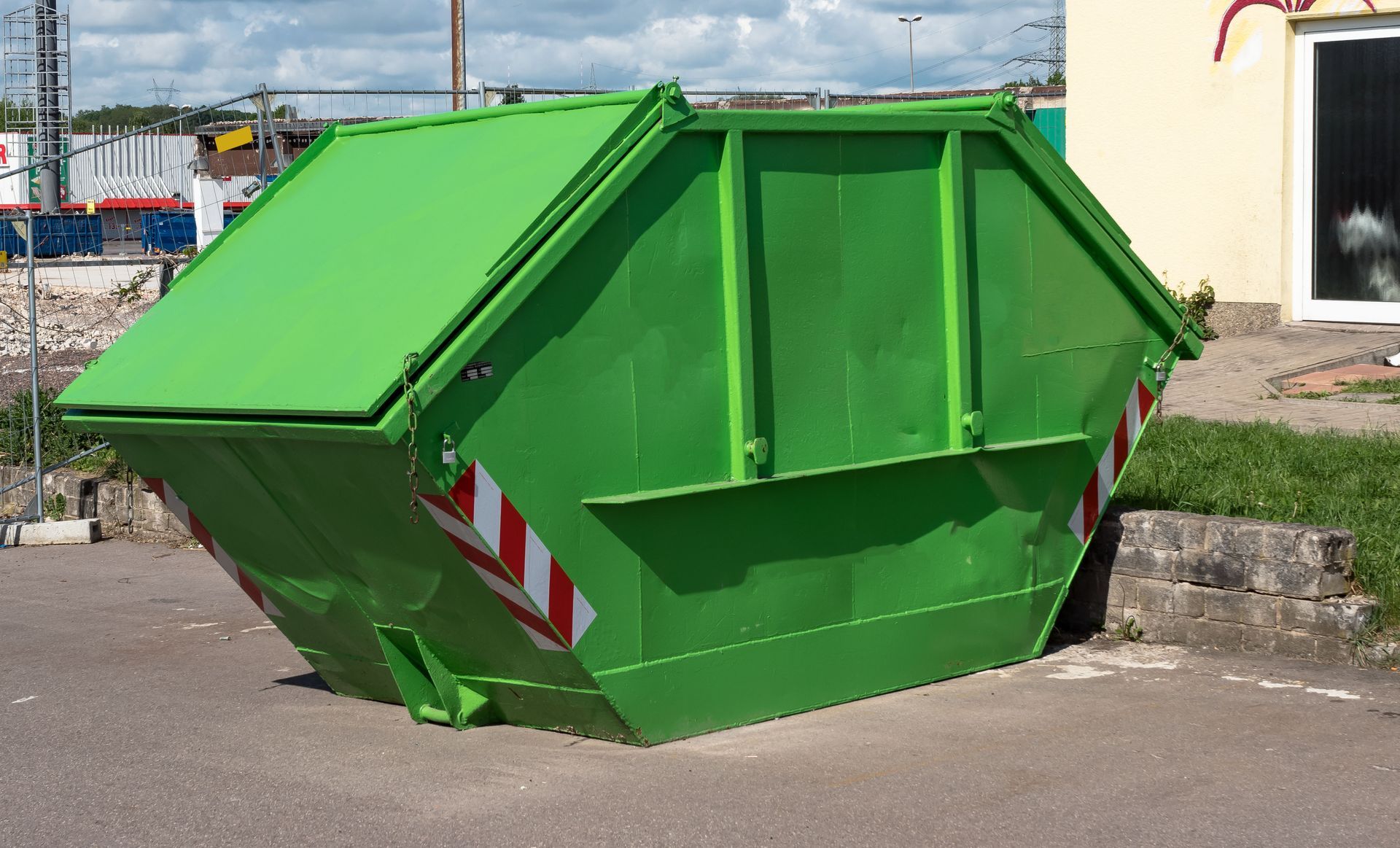 Big green front-load dumpsters