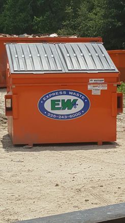 An orange dumpster with the word express waste on it