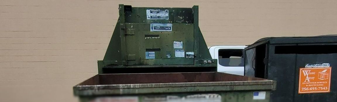 Large green iron dumpster garbage metal recycle outdoor