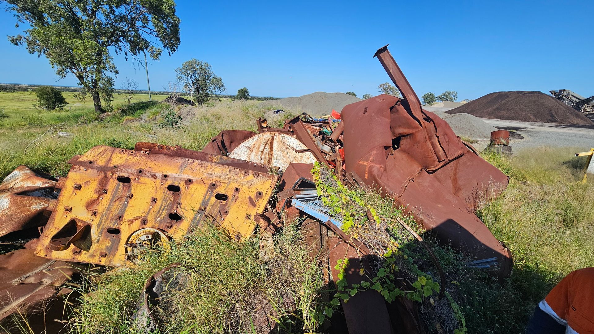 Dirt Clearing With Tire Tracks, Trees in Background, and Blue Sky — NPX Solutions In Rockhampton City, QLD