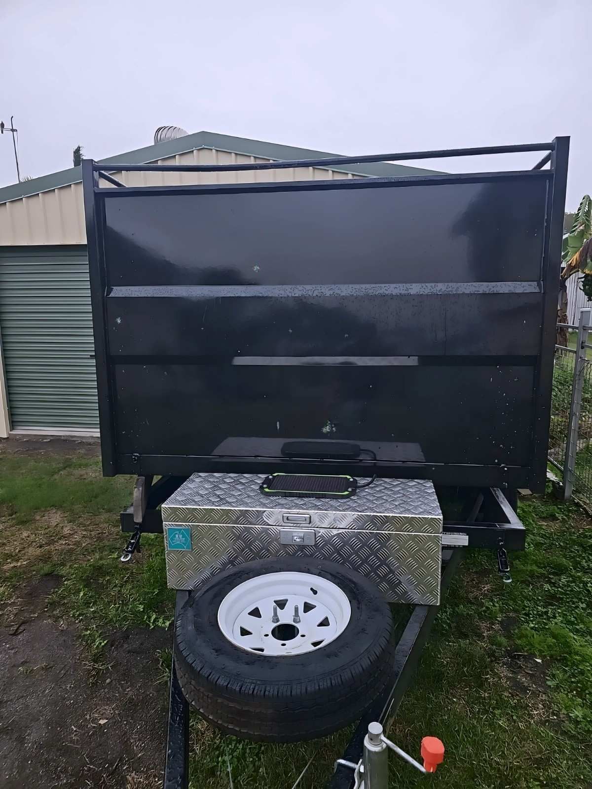 Black Utility Trailer With Spare Tire, Metal Toolbox — NPX Solutions In Yeppoon, QLD