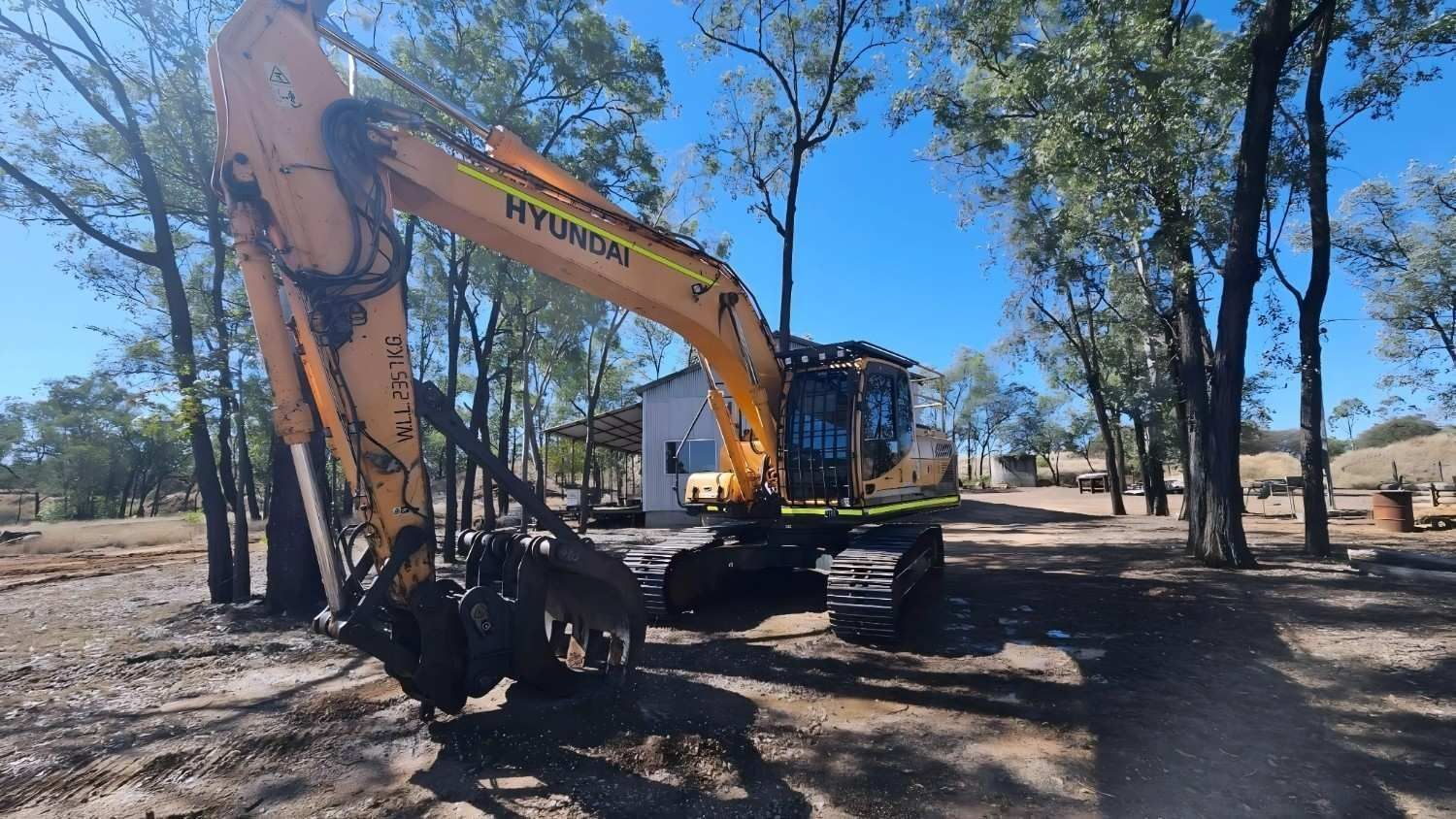 Yellow Hyundai Excavator With a Grapple Attachment — NPX Solutions In Rockhampton City, QLD