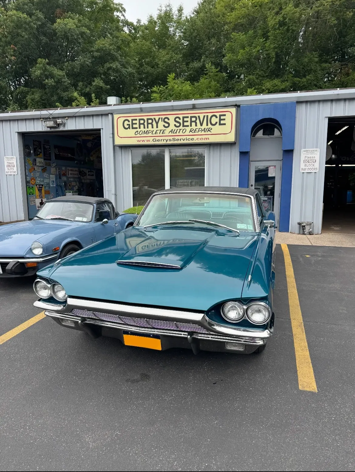 Classic green car parked in front of our shop | Gerry's Service
