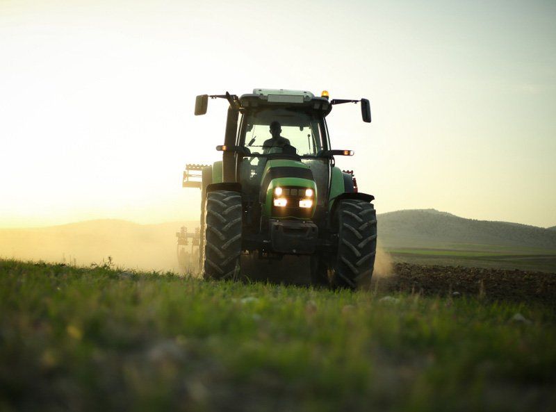 Farmer Trying To Finish Sunset Works With His Tractor — O'Brien's Machinery In Coonabarabran