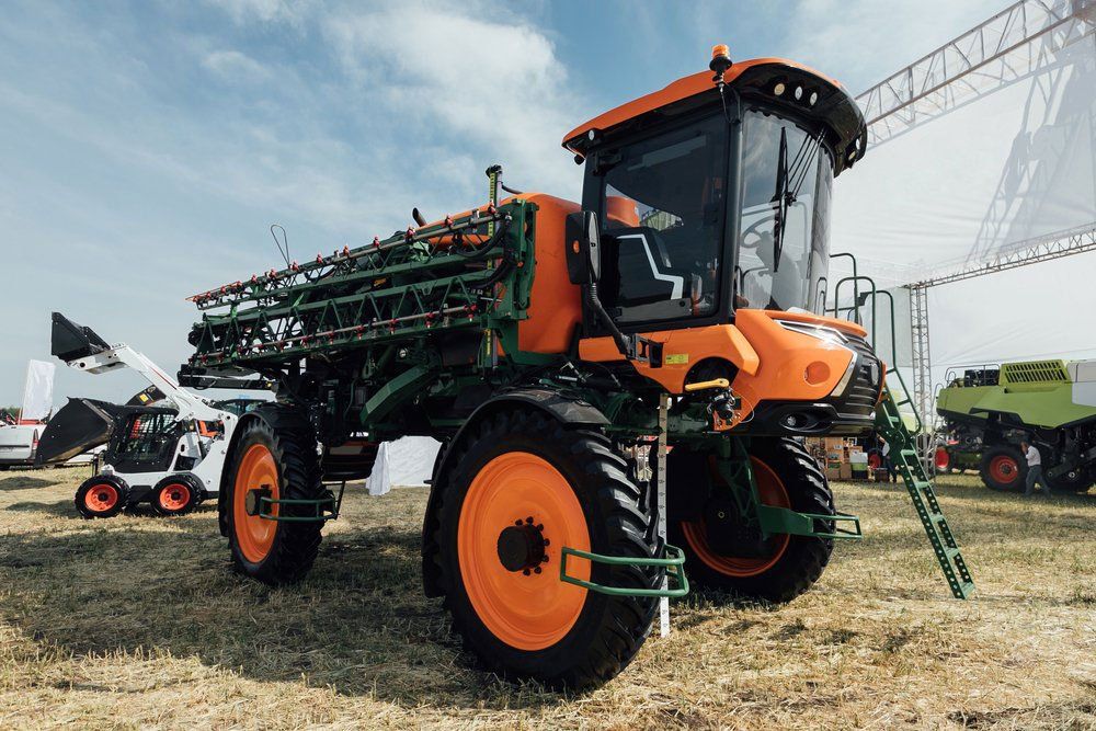 Orange Tractor With Sprayer — O'Brien's Machinery In Dubbo