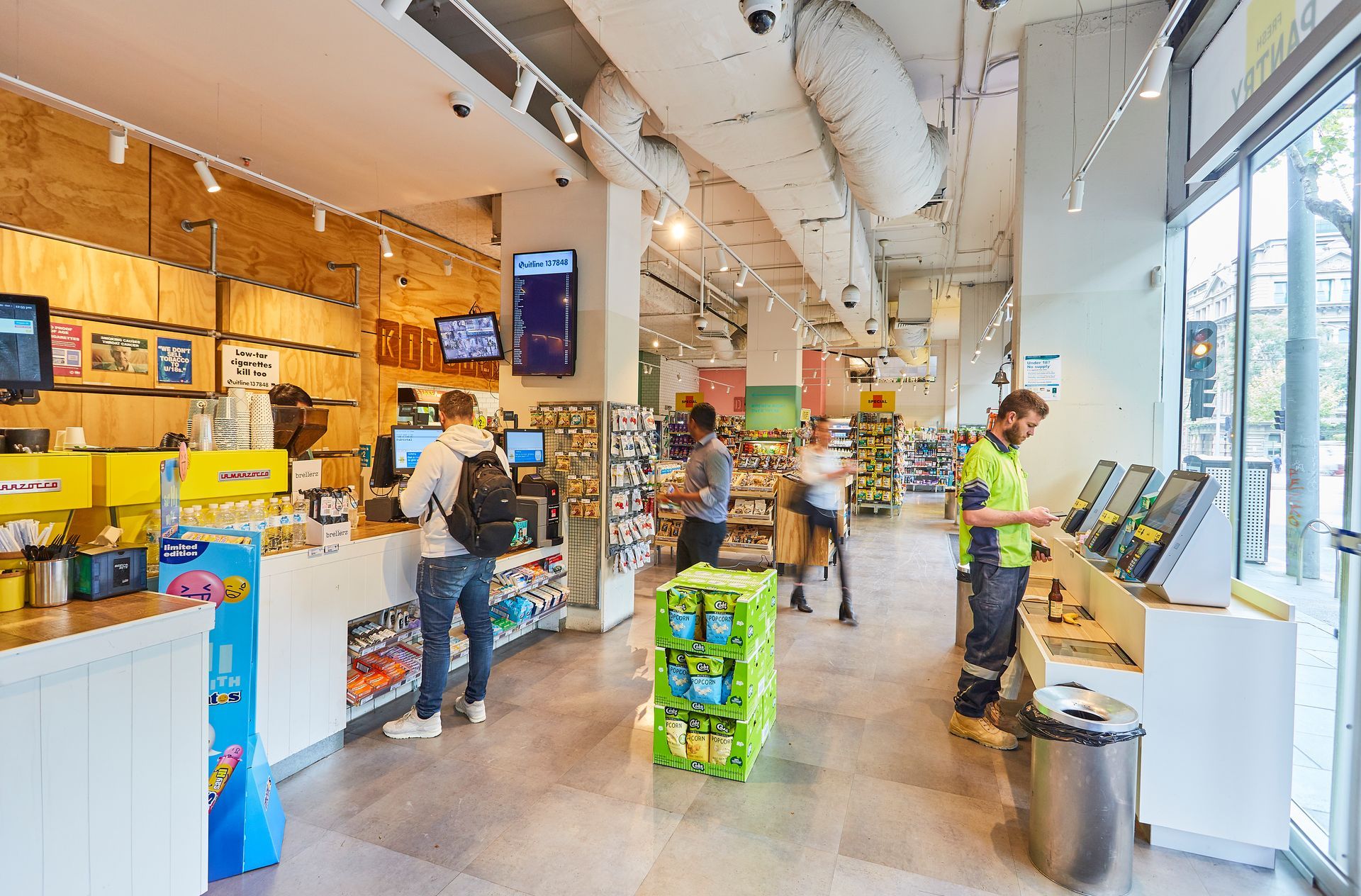 A group of people are standing in a store.