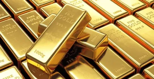 A pile of gold bars stacked on top of each other.