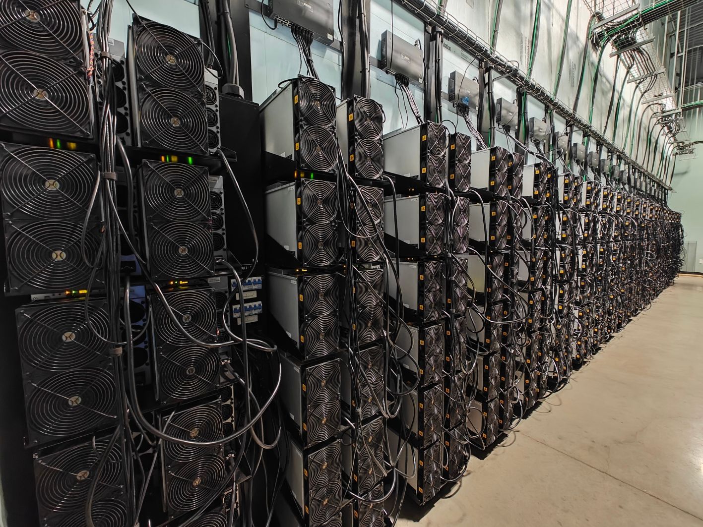A large room filled with lots of computer servers.