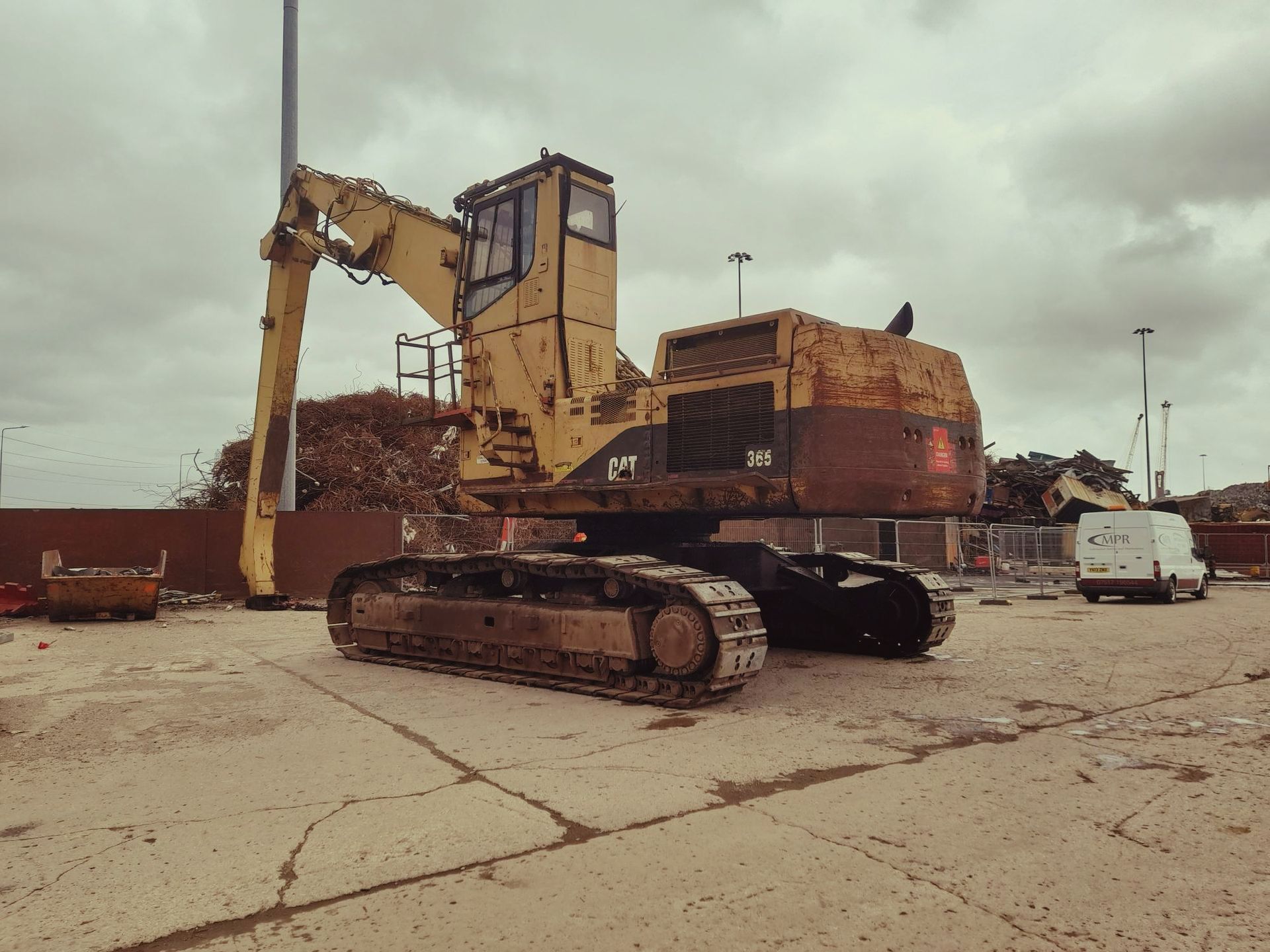 big cat machine yellow in yard