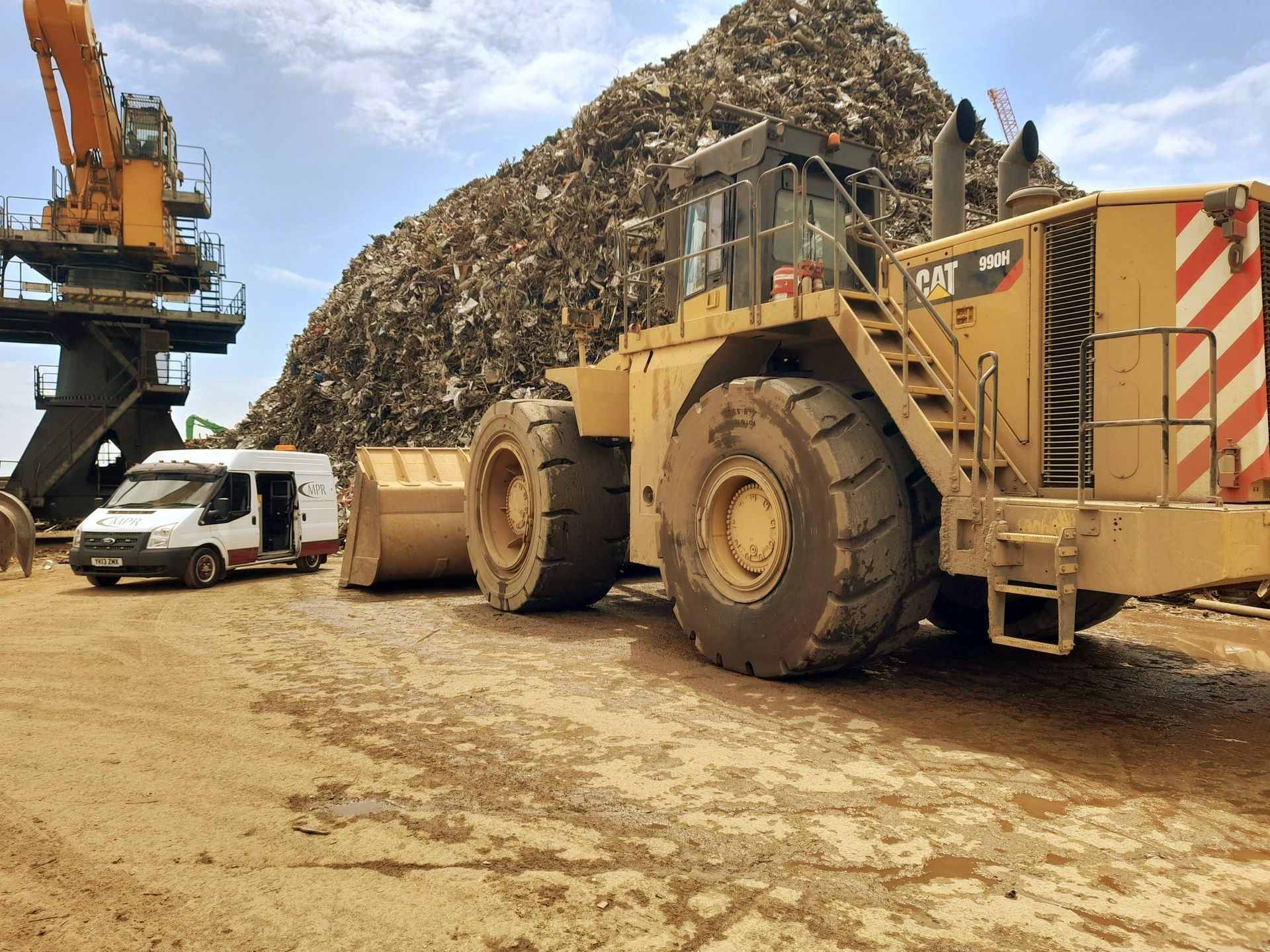transit ford mk2 l2h2 van 2014 signwritten MPR with bit CAT vehicle in scrapyard, pile of scrap behind.