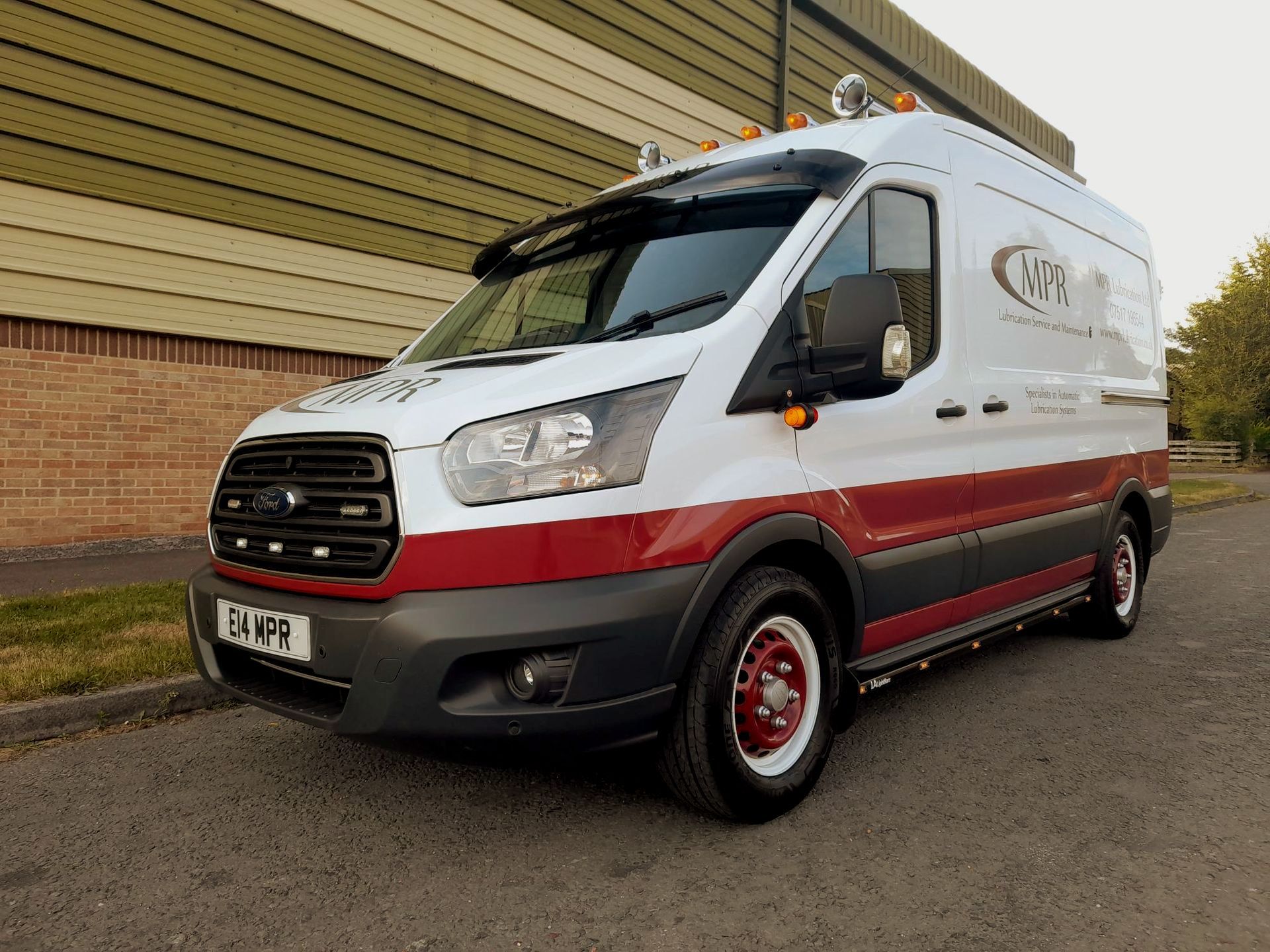 ford transit van with burgundy signwriting MPR red wheels