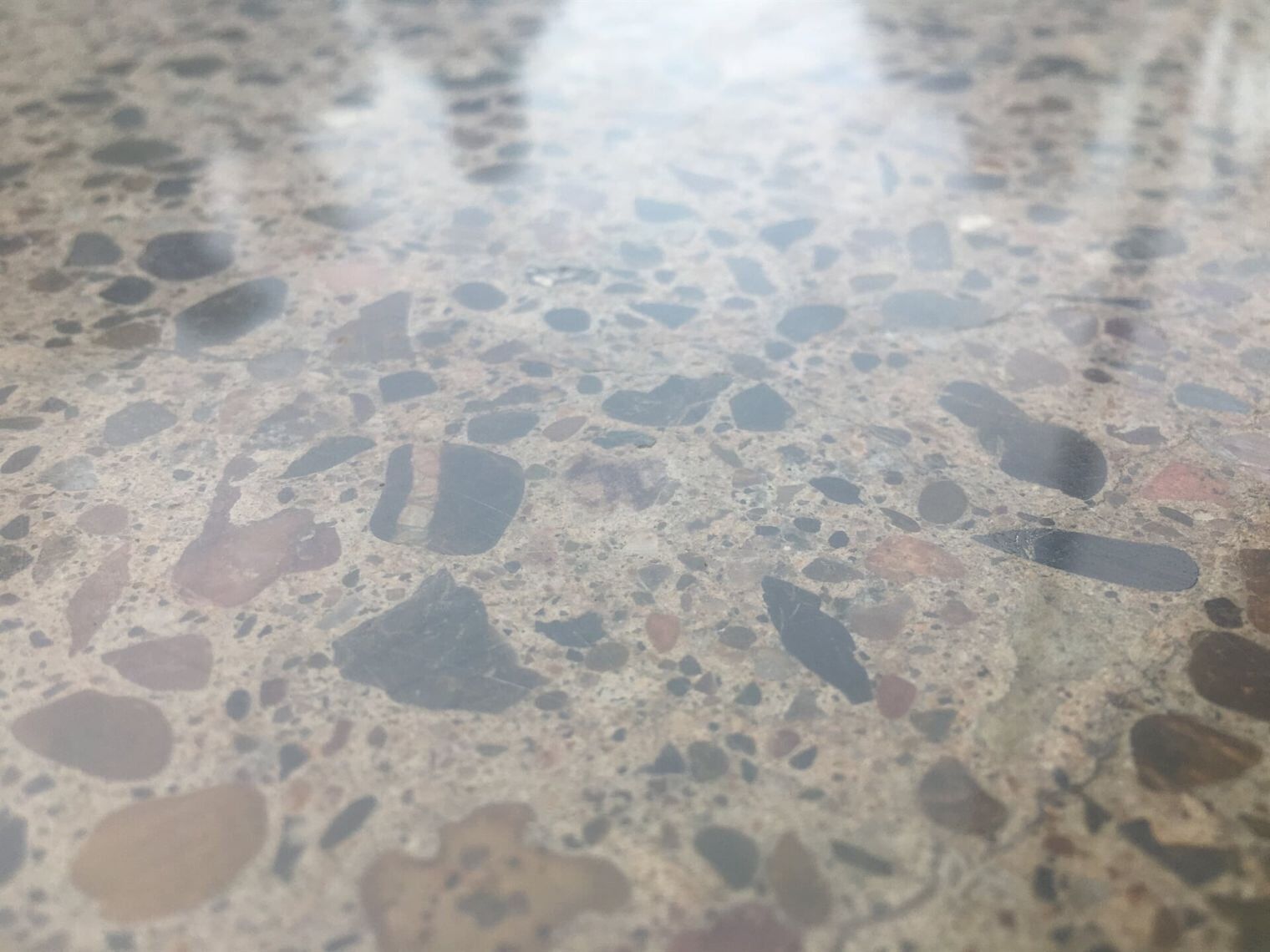 A Close Up Of A Terrazzo Floor With A Lot Of Rocks On It  — River2Coast Concreting in Coffs Harbour, NSW