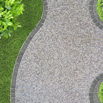 An Aerial View Of A Curved Walkway In A Garden  — River2Coast Concreting in Coffs Harbour, NSW
