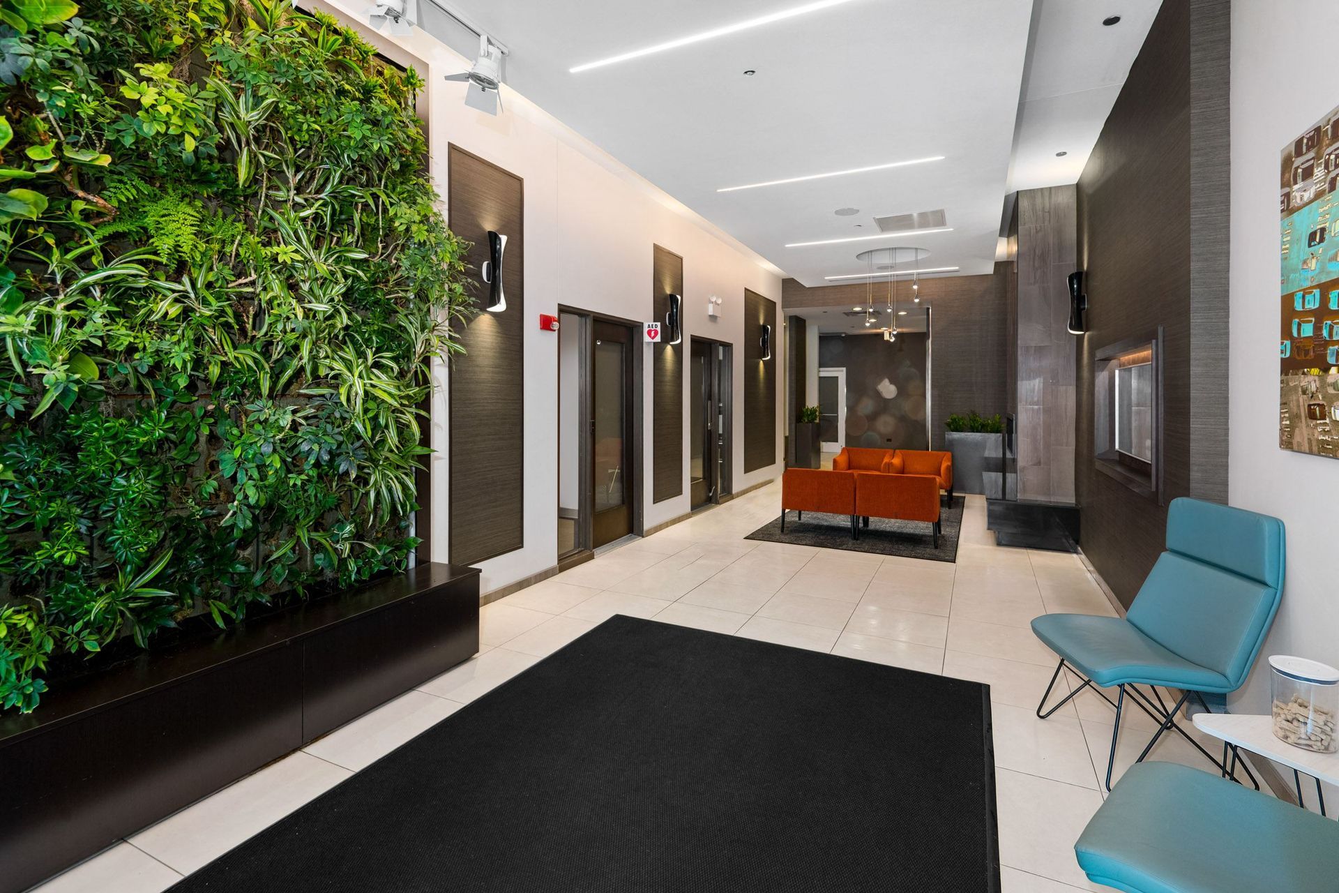 a green wall in the lobby of a building