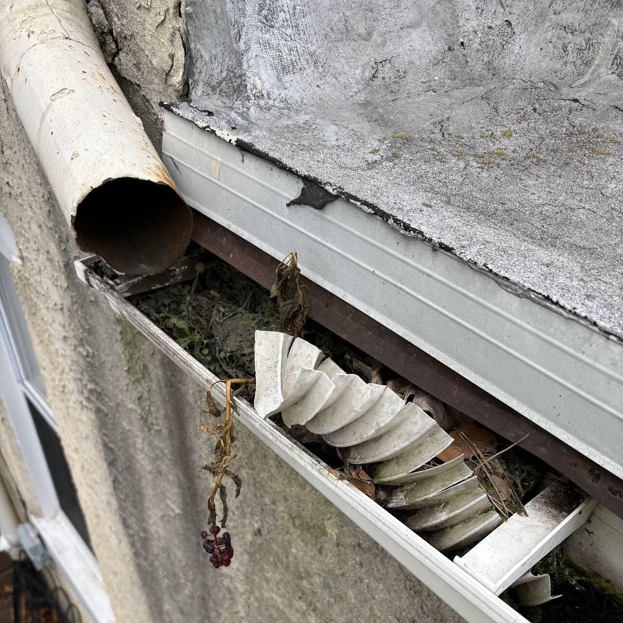 A Gutter With A Pipe Coming Out Of It — Wilmington, DE — Jennings Home Rejuvenation