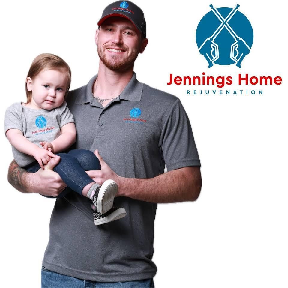 A Man Is Holding A Baby — Wilmington, DE — Jennings Home Rejuvenation