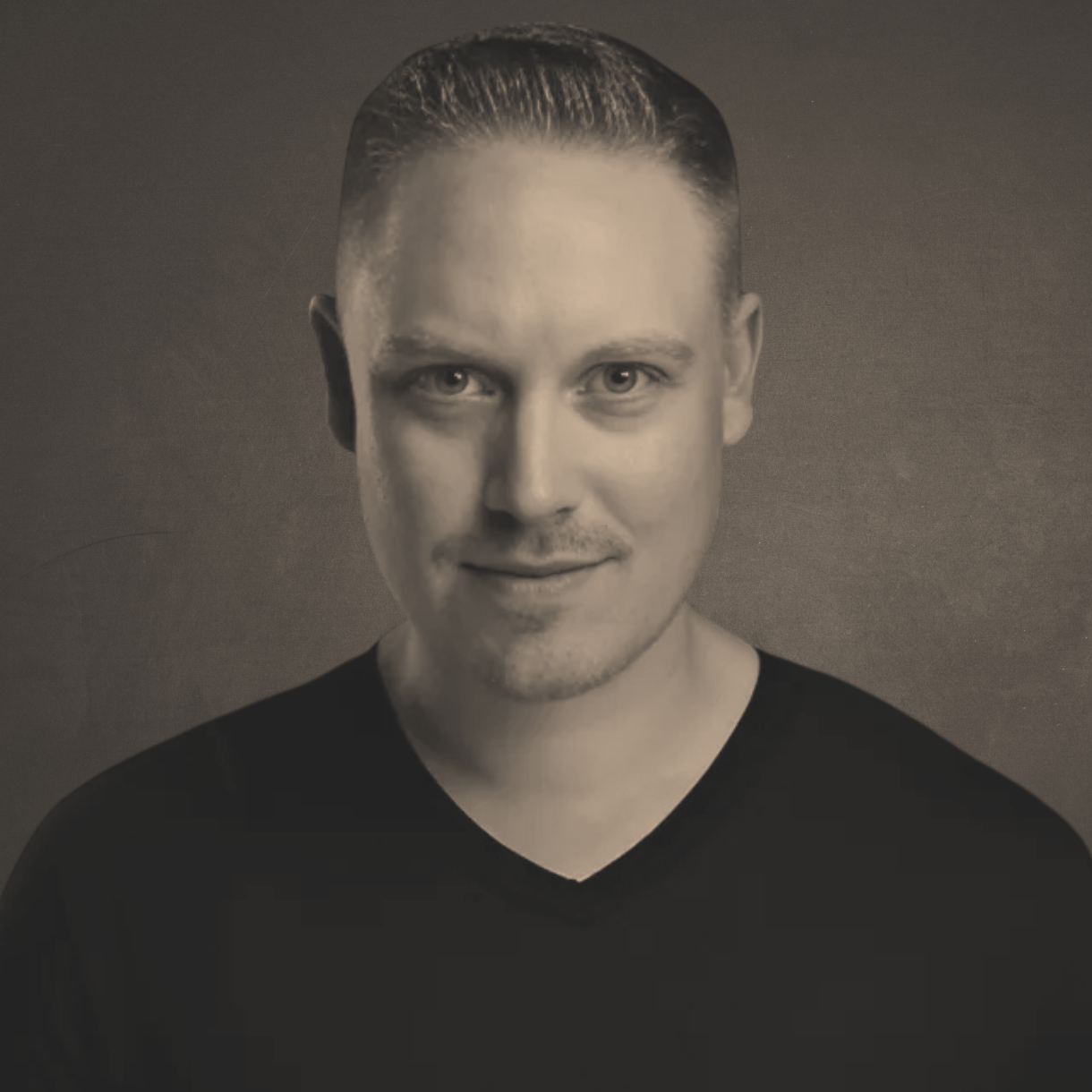 Ken Osborne: A man with a beard is wearing a suit and tie