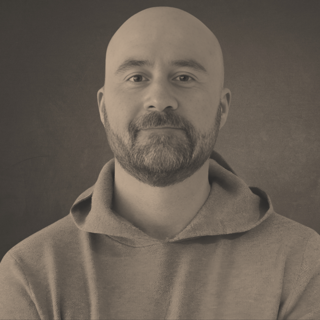 Ken Osborne: A man with a beard is wearing a suit and tie