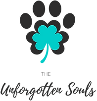 A logo for the unforgotten souls with a paw print and a clover.