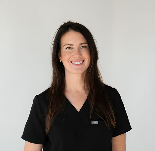 Woman with dark hair, wearing a black scrub top — HealthPoint Mingara In Tumbi Umbi, NSW