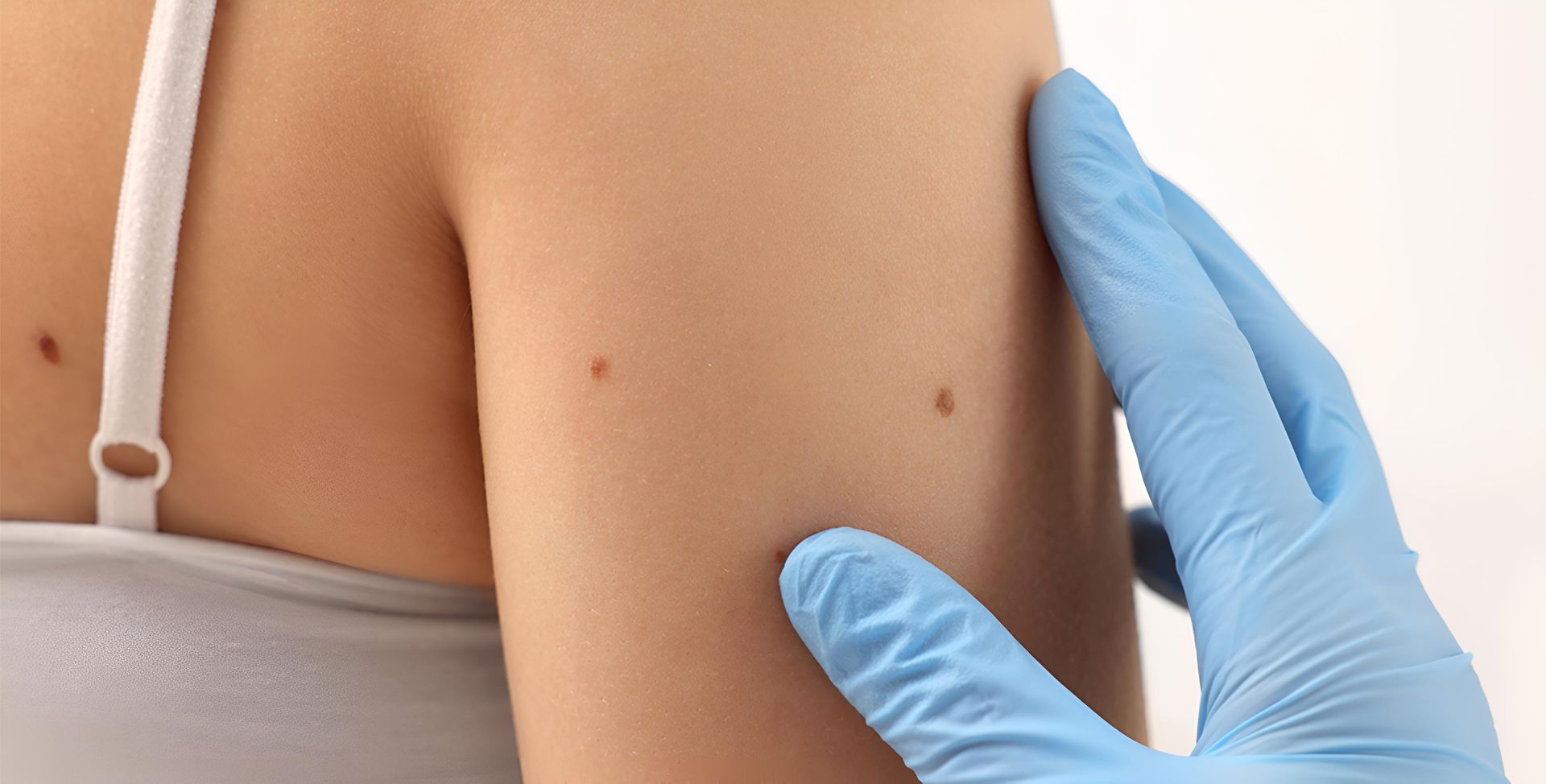 A Black And White Photo Of A Person's Back With Their Hands On It — HealthPoint Mingara In Tumbi Umbi, NSW
