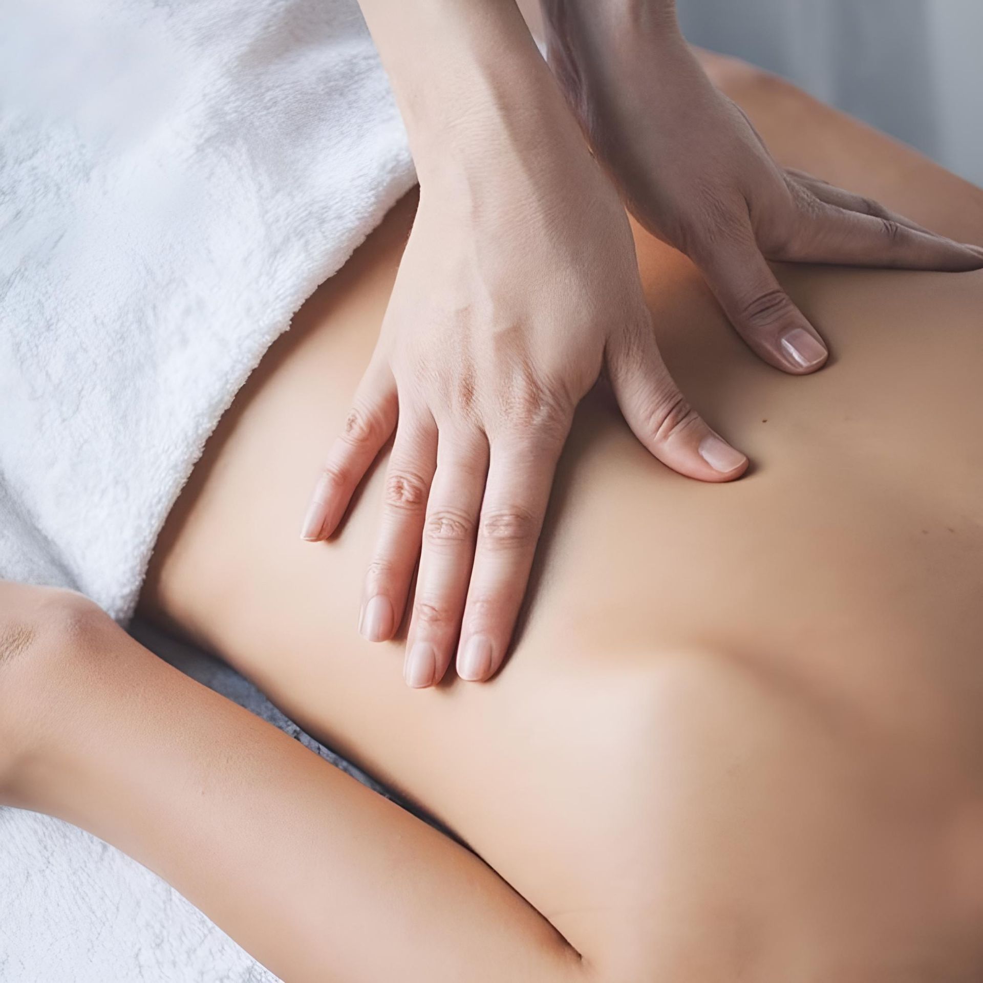 A Woman Is Getting A Massage On Her Back In A Spa — HealthPoint Mingara In Tumbi Umbi, NSW