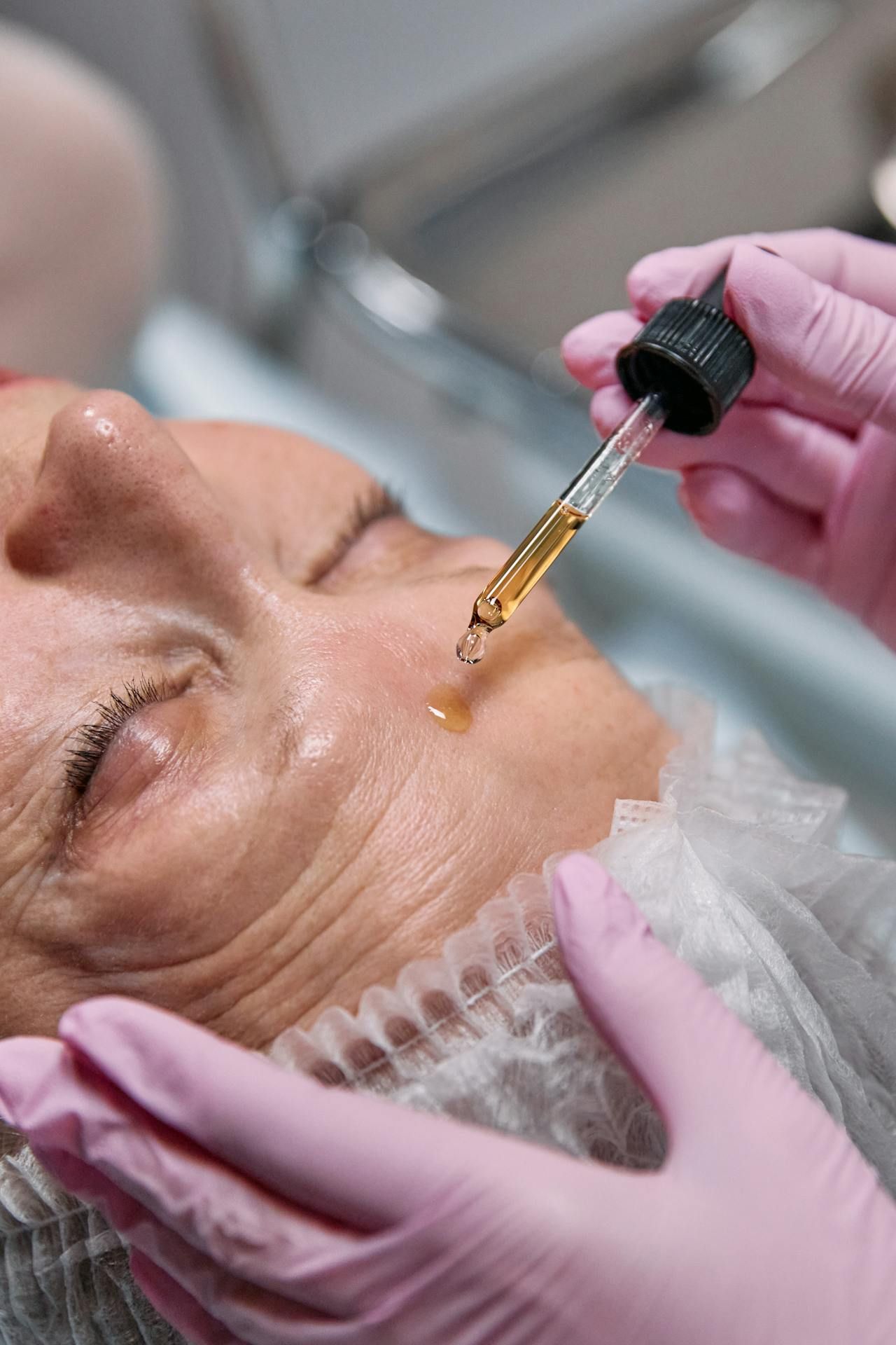 A Woman Getting Her Face Cleansed — HealthPoint Mingara In Tumbi Umbi, NSW