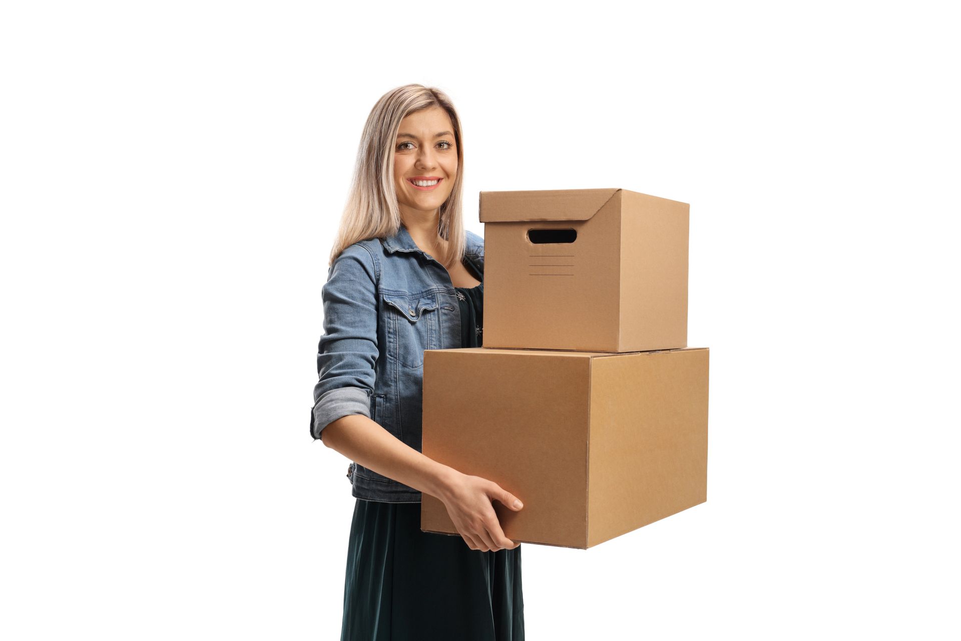 Young cheerful woman carrying two cardboard boxes isolated on a white background.