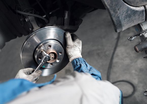 Mechanic Replacing Brake — Nashville, TN — Donelson Muffler & Hitch