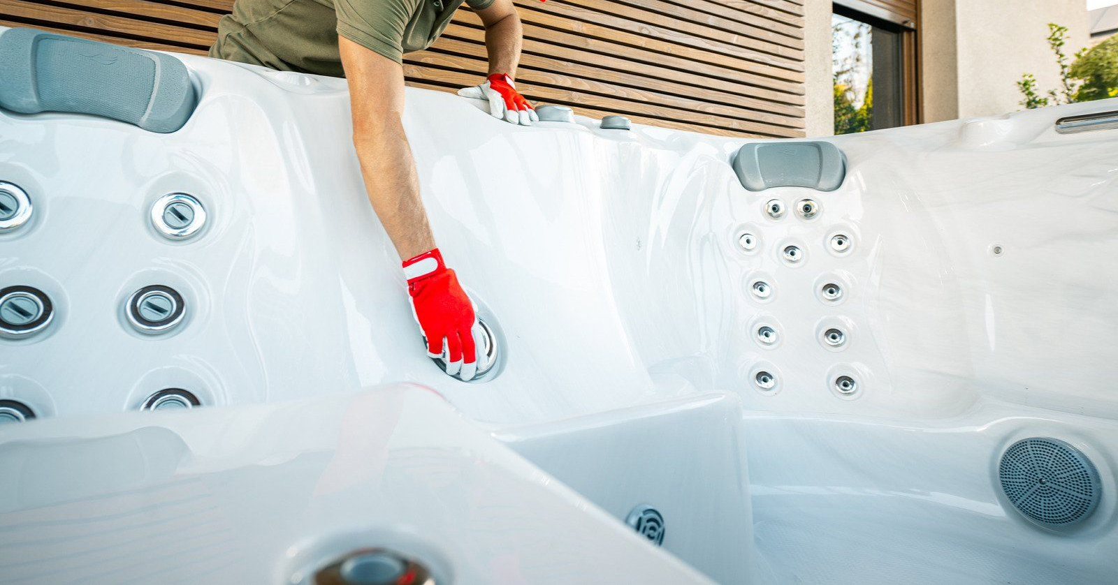 A wooden fence is sitting on top of a lush green field.