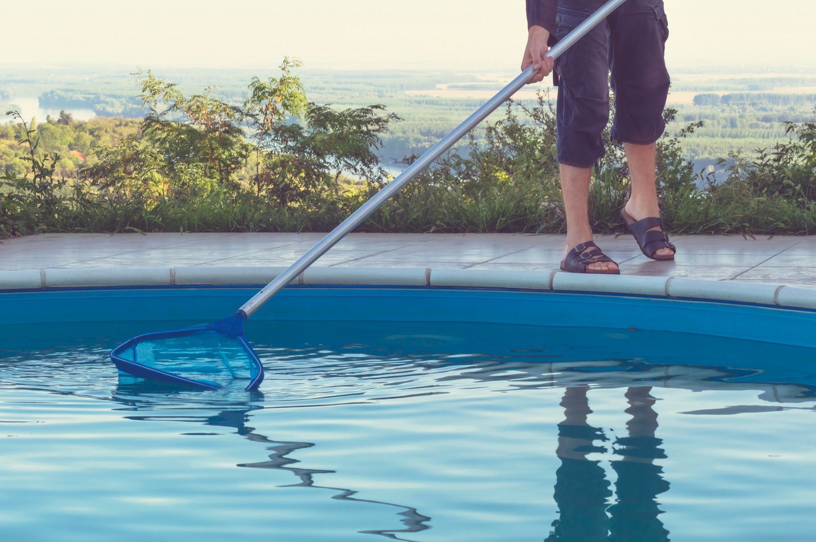 A wooden fence with a gate attached to it.