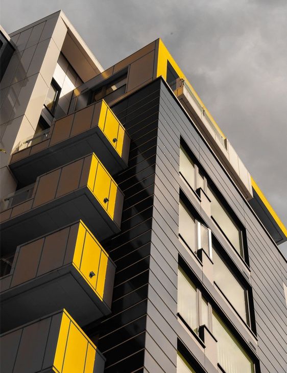High rise building with yellow balconies