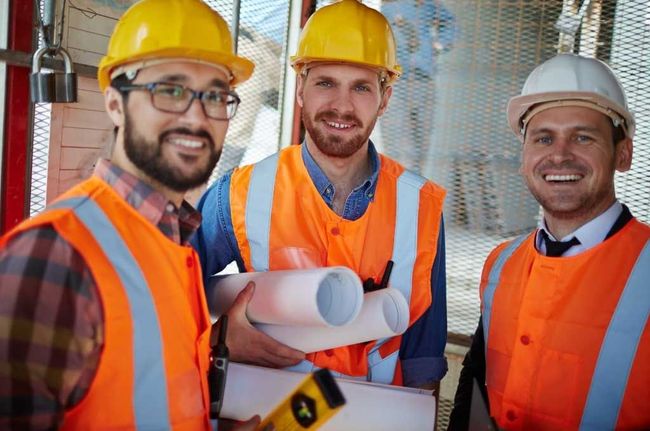 Site foreman smiling at camera