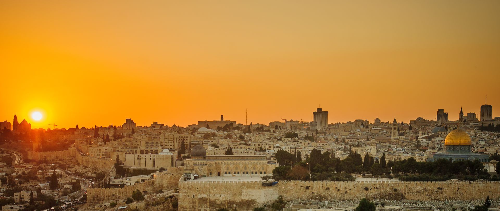 Sunset over Jerusalem with golden dome.