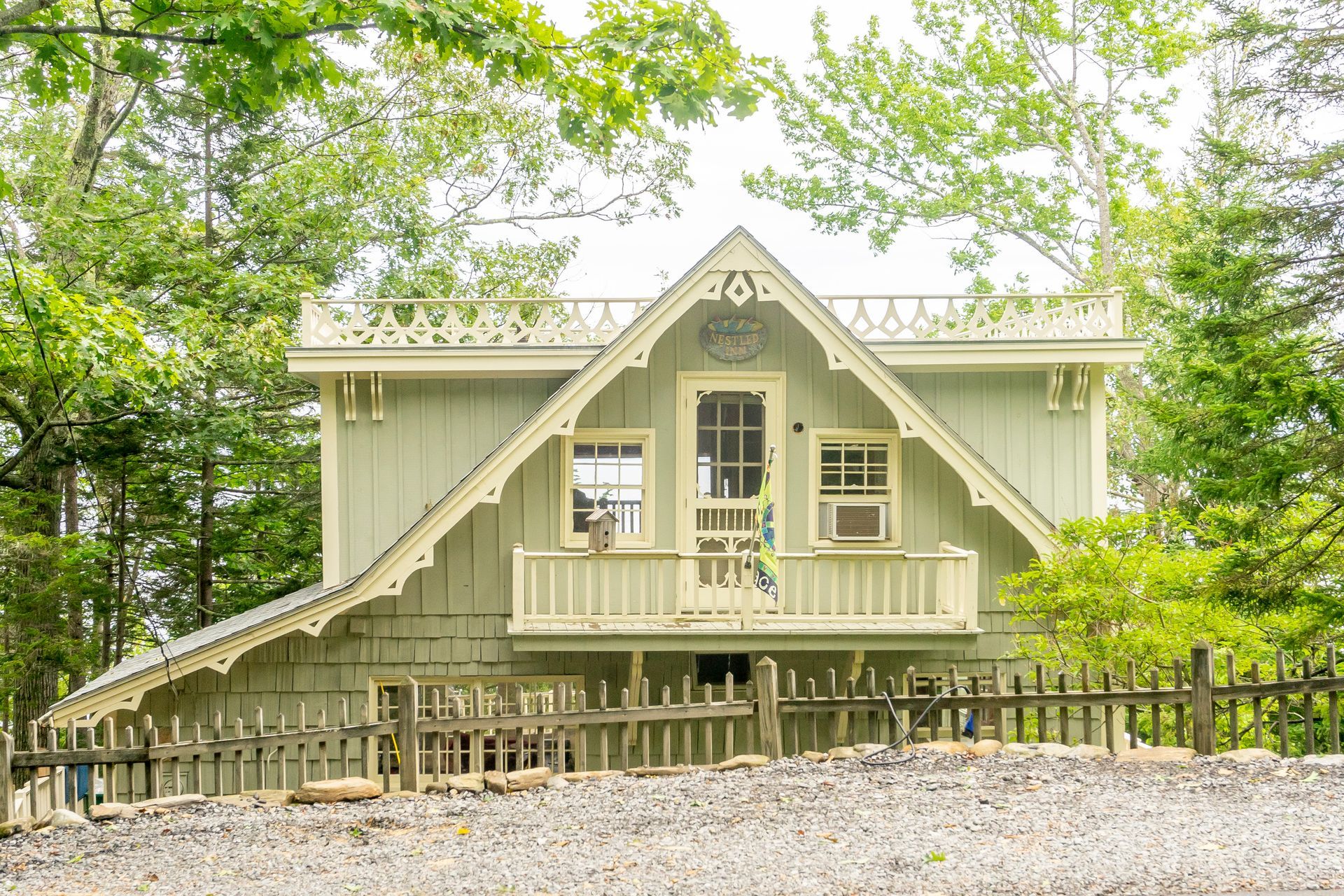 Whitecap Builders restored an older seasonal cottage with new siding, decking, and windows in Islesboro, Maine.