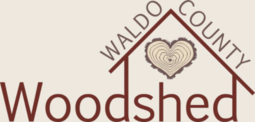 A logo for waldo county woodshed with a heart on the roof