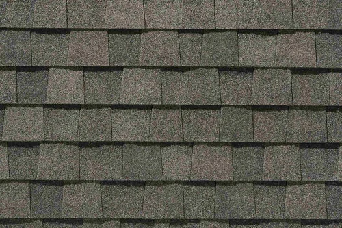 A close up of a roof with shingles on it.