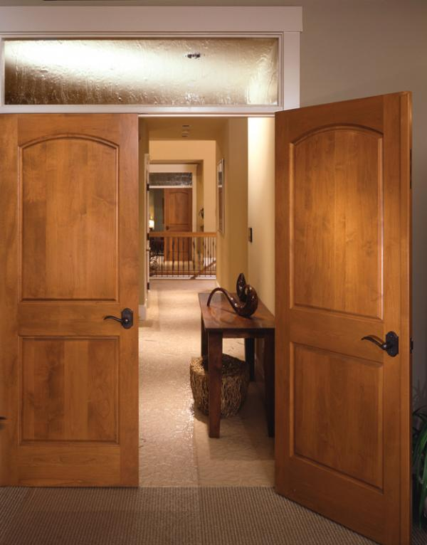 Whitecap Builders installed custom wood doors and finish trim throughout a new home in Searsmont, Maine.