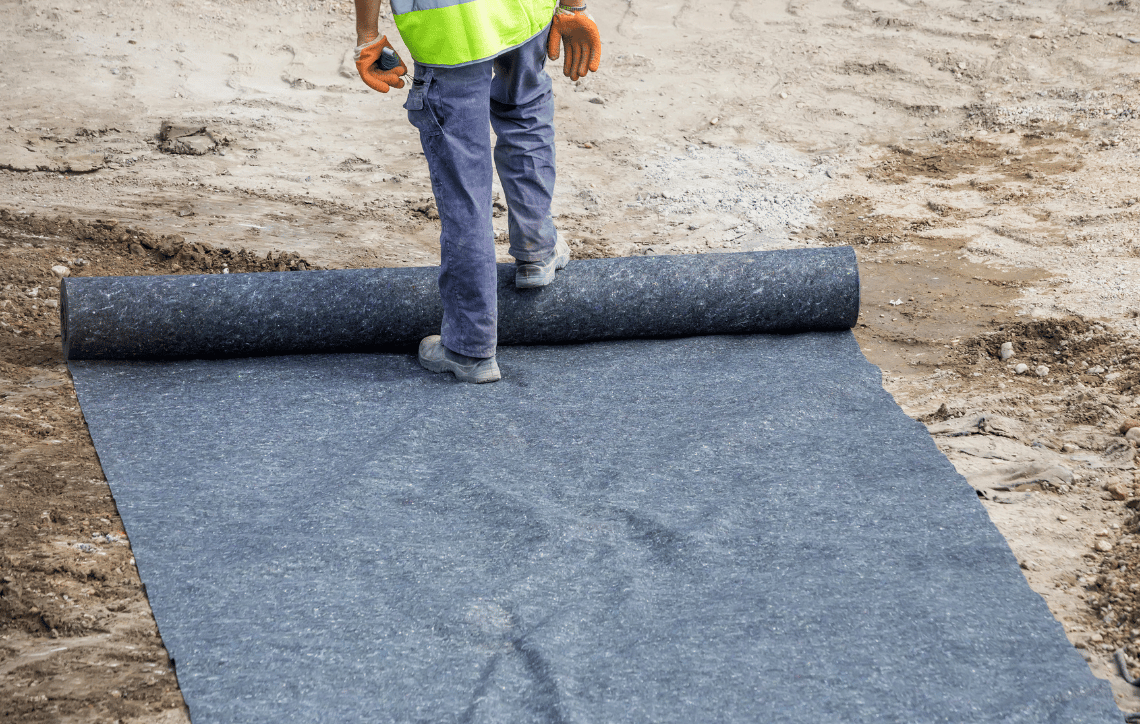 Whitecap Builders installed geotextile fabric for drainage and erosion control in Liberty, Maine.