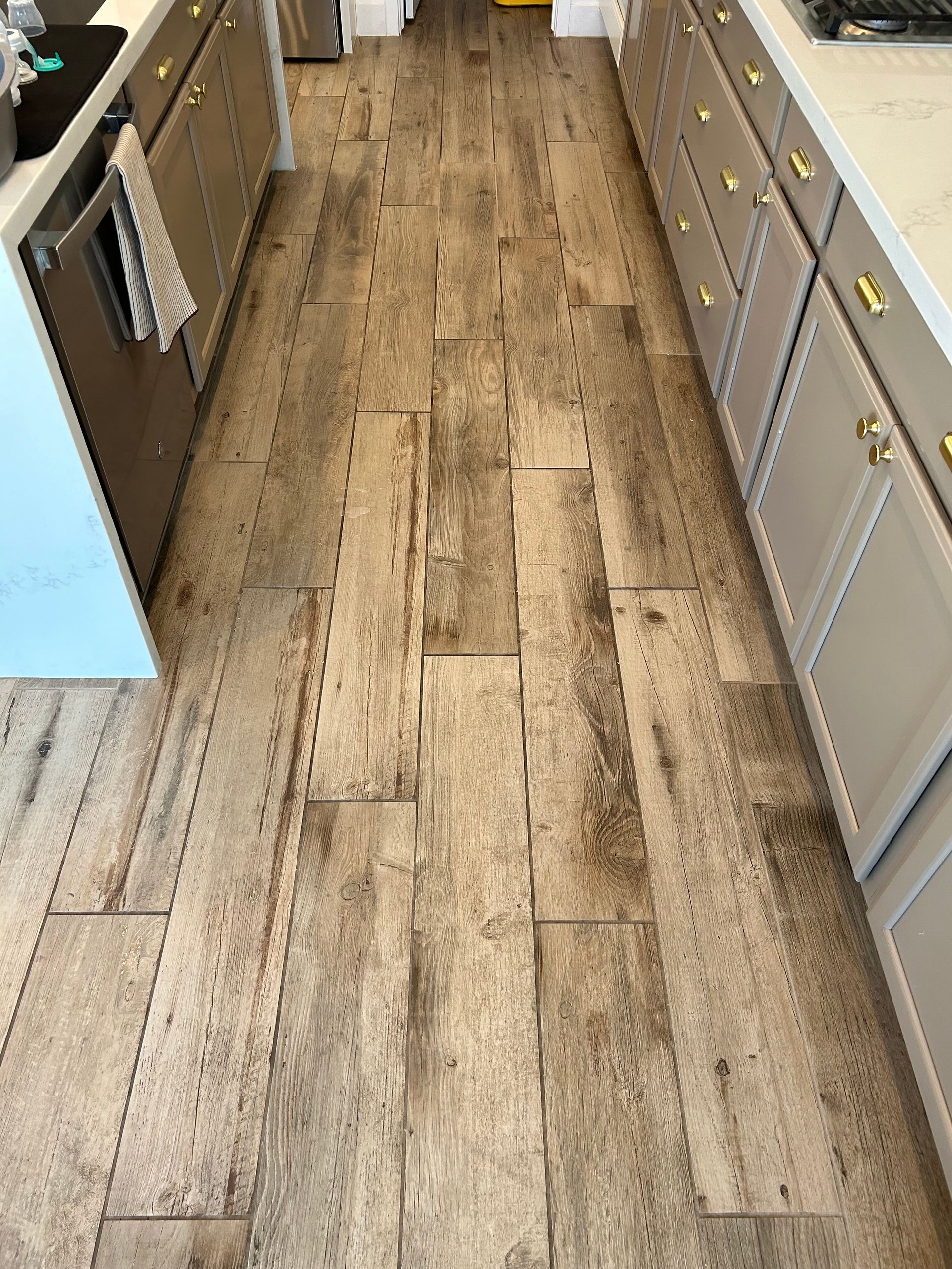 A hallway with a striped pattern on the floor.