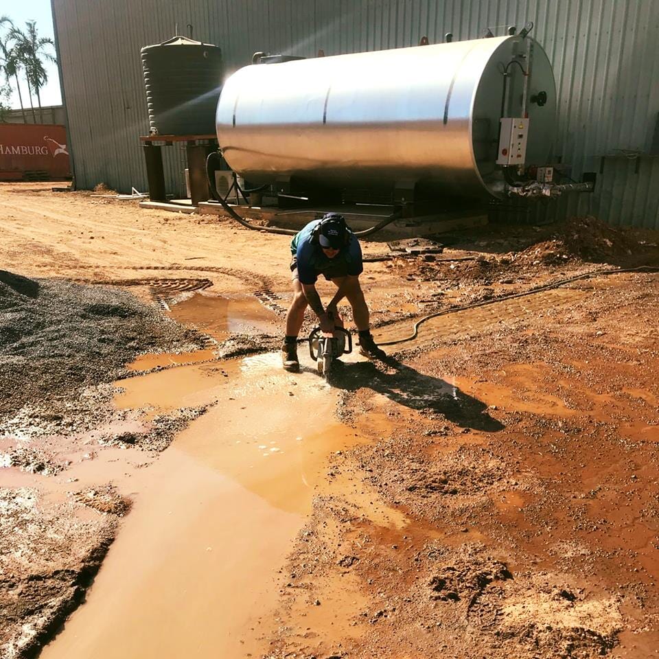 Emergency plumber fixing burst water pipe — Plumbers in Darwin, NT