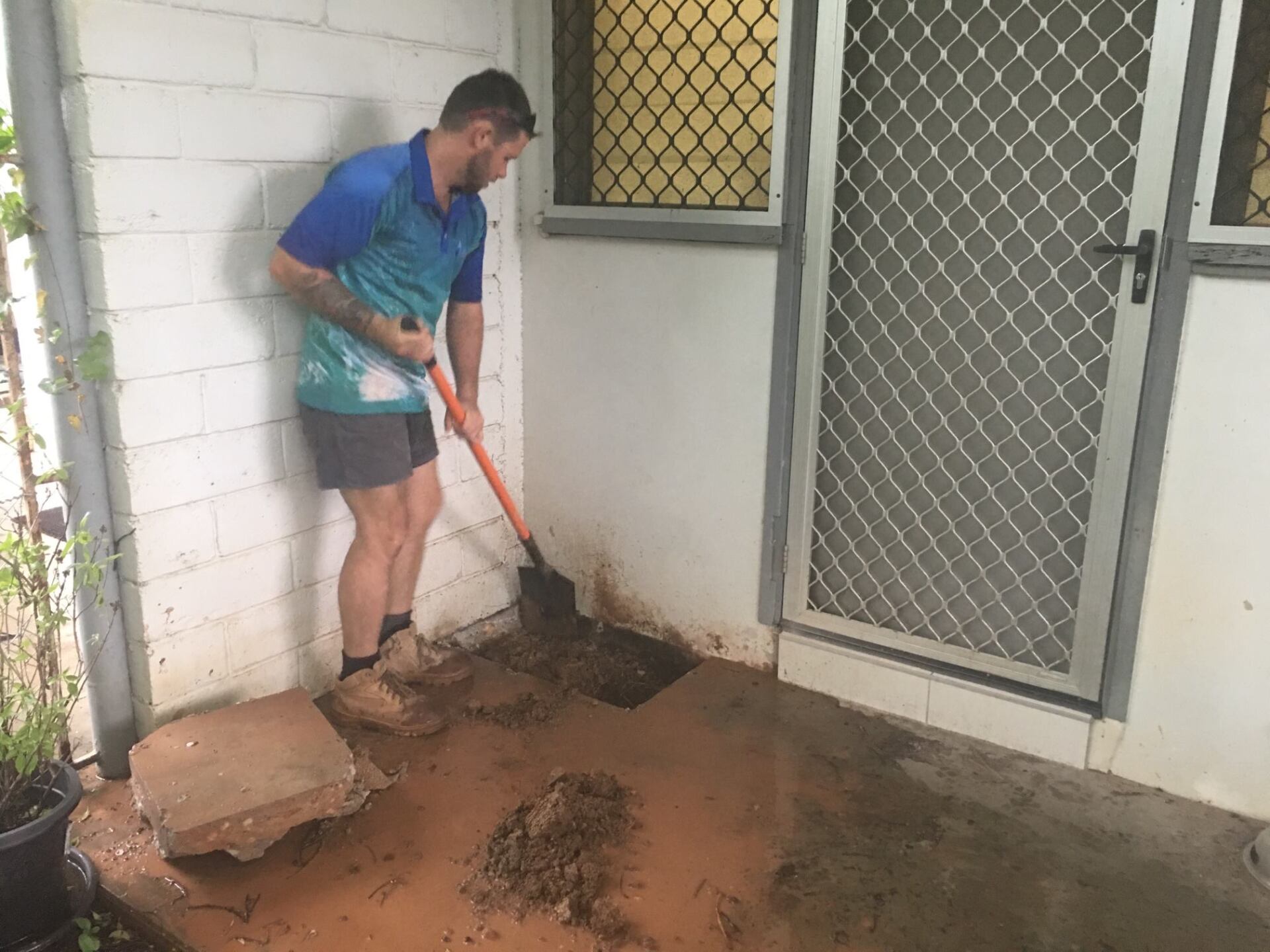 Plumber is checking for broken waterpipes under concrete slab - Darwin, NT