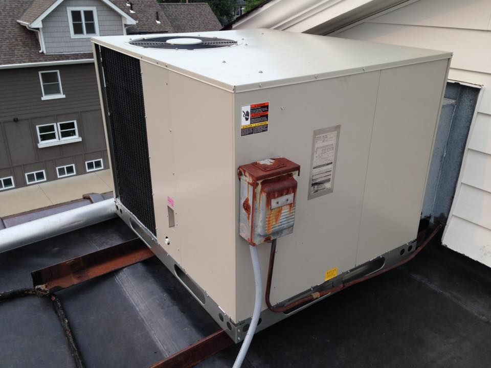 Large commercial rooftop HVAC unit installed for full building heating and cooling