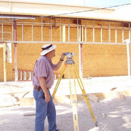 Land surveyor using a surveying tool