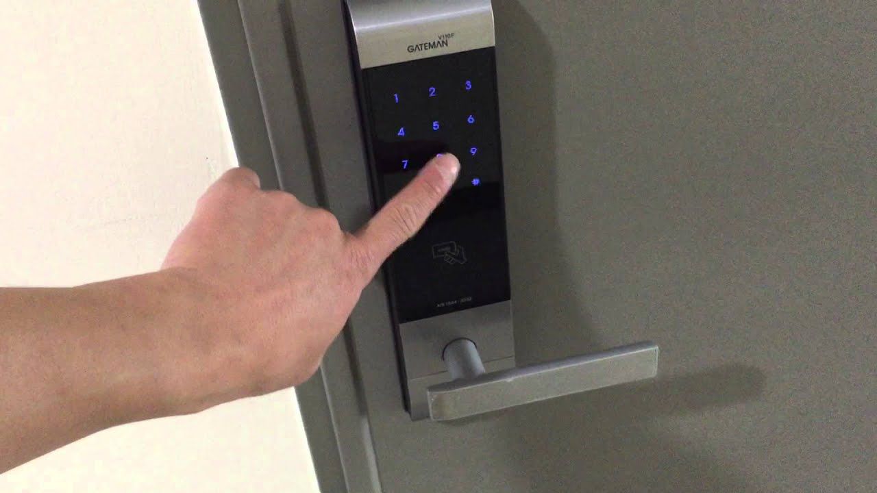 Man using lockpicker to unlock a red car door.