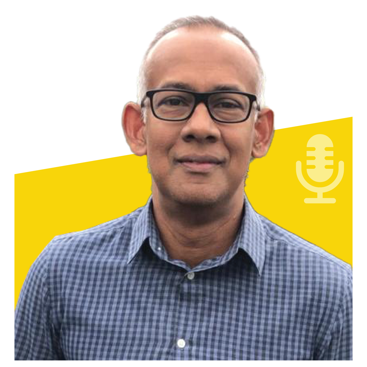 Man with glasses smiling, wearing a blue checkered shirt, yellow background with a podcast microphone icon.