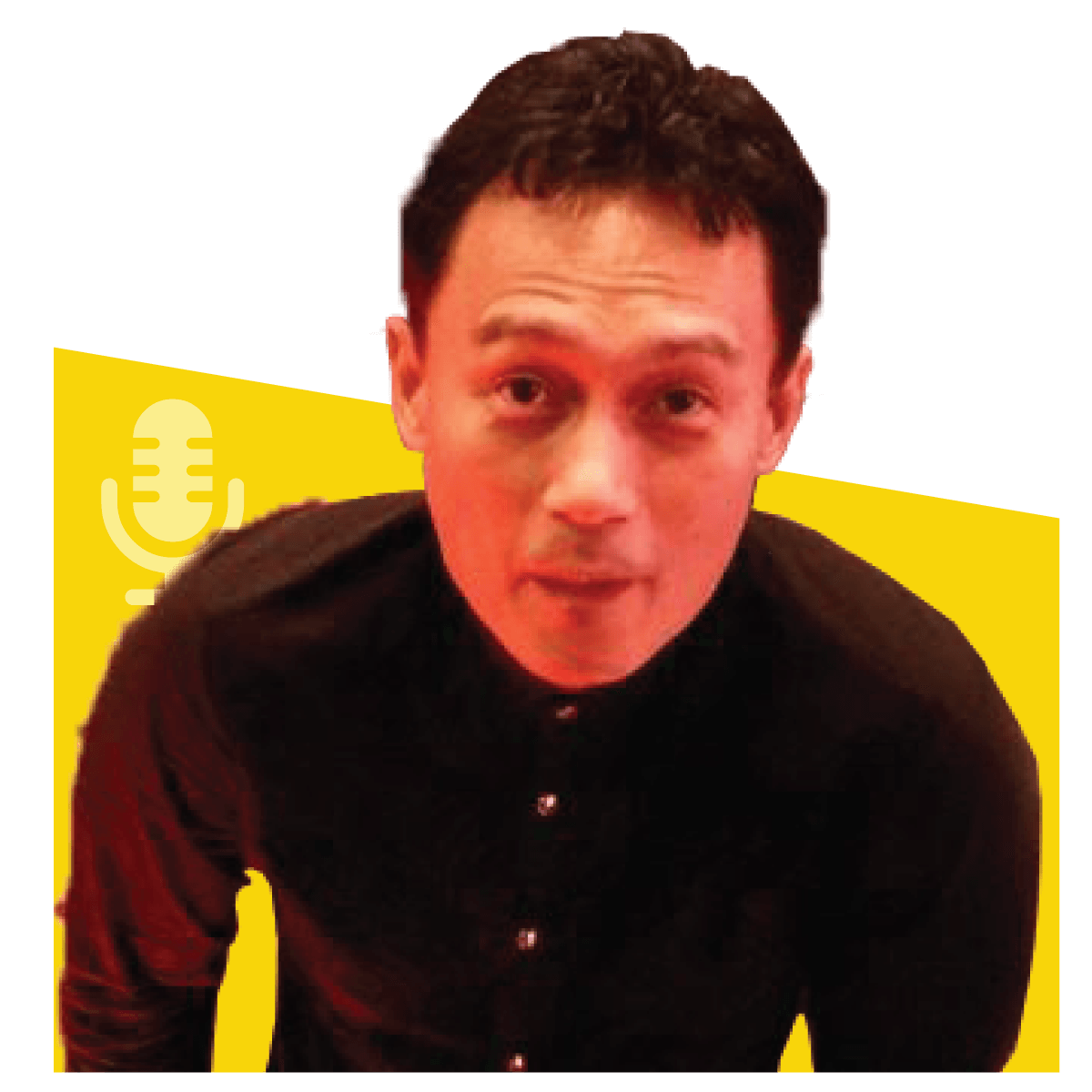 Man with dark hair, wearing a black shirt, in front of a yellow background with a microphone icon.