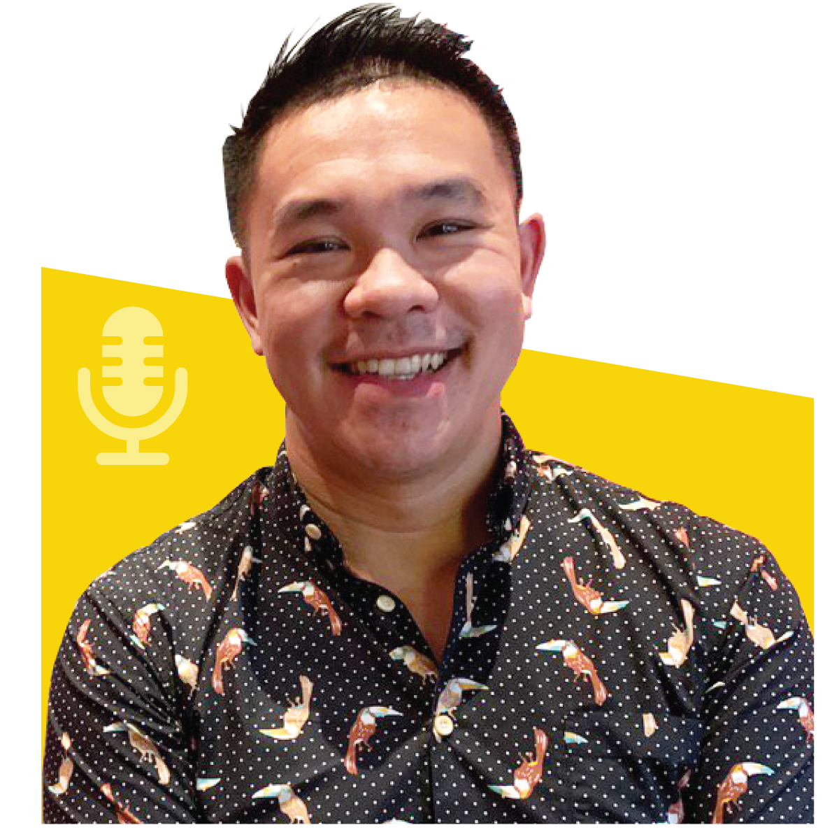 Smiling Asian man with short black hair in a black shirt with colorful bird pattern