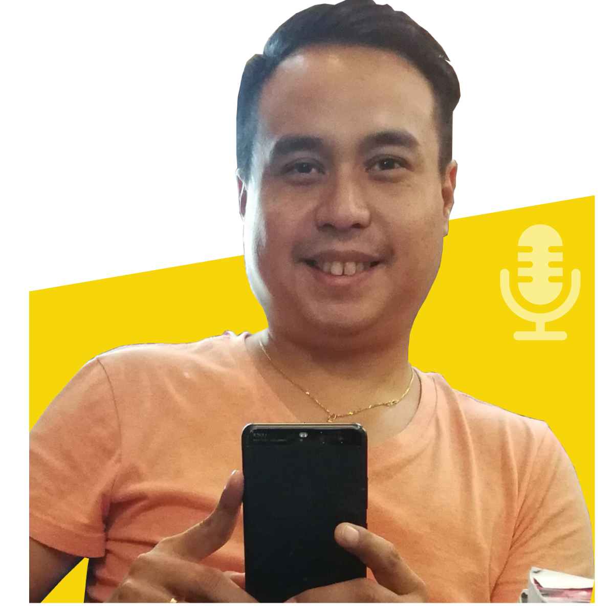Man holding phone, smiling at camera. Wearing orange shirt, gold chain. Yellow and white background with microphone icon.