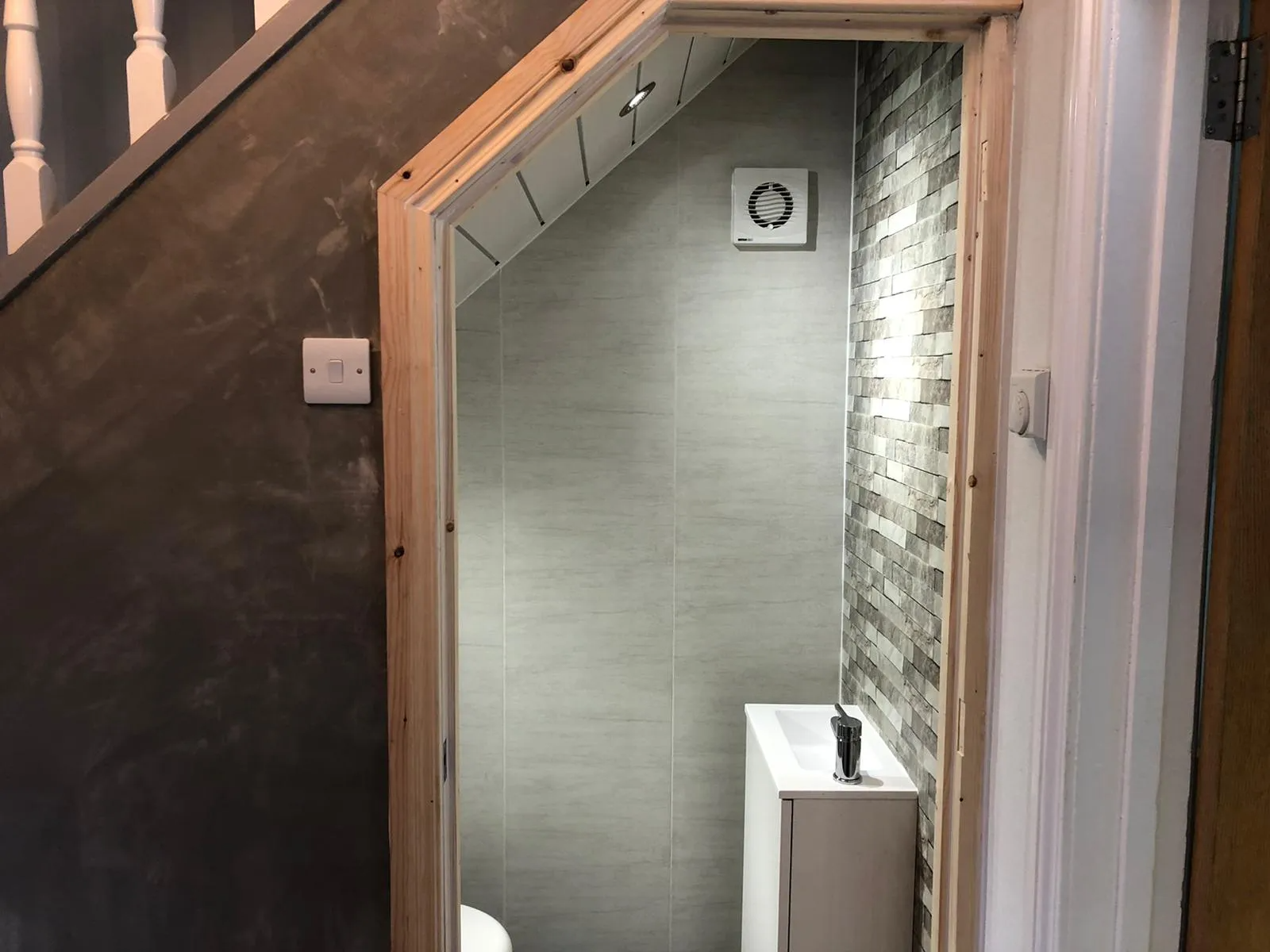 toilet added under stairs